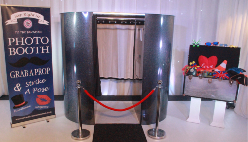 Standard enclosed photo booth with carpet, barrier and prop box